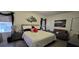 Comfortable bedroom with a chic seating area and stylish decor at 1292 Cascades Ave, Davenport, FL 33837