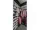 Spacious walk-in closet with custom shelving for shoes and clothing at 1292 Cascades Ave, Davenport, FL 33837