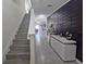 Modern hallway with decorative wall panel, console table and stylish decor at 1292 Cascades Ave, Davenport, FL 33837