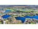 Beautiful aerial shot of a lakefront community with access to a golf course and scenic walking paths at 142 Magellan Ct, Davenport, FL 33837