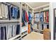 Walk-in closet with custom shelving, providing ample storage for clothing and shoes at 142 Magellan Ct, Davenport, FL 33837