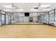 Well-lit dance studio with wood floors, mirrors, and ballet barres at 142 Magellan Ct, Davenport, FL 33837