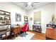 Functional home office with wood desk, shelves, and natural light, ideal for working from home at 142 Magellan Ct, Davenport, FL 33837