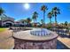 Outdoor fireplace and seating near the clubhouse and pool at 142 Magellan Ct, Davenport, FL 33837