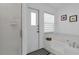 Clean bathroom featuring a shower, bathtub, and a window with blinds at 1520 Oak Hill Trl, Kissimmee, FL 34747