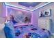 Nicely decorated 'Frozen' themed bedroom with custom design and lighting, and modern entertainment system at 1520 Oak Hill Trl, Kissimmee, FL 34747