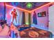 Themed bedroom with Star Wars decor, neon accents, and twin beds at 1520 Oak Hill Trl, Kissimmee, FL 34747