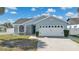 Charming one-story home featuring a two-car garage and well-maintained landscaping at 1520 Oak Hill Trl, Kissimmee, FL 34747