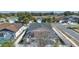 Aerial view of a screened-in pool with outdoor patio furniture in a fenced yard at 1520 Oak Hill Trl, Kissimmee, FL 34747