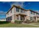 Shows the exterior of a two-story townhome with well-manicured lawn and simple landscaping at 1567 Dawnview Way, Kissimmee, FL 34744