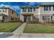 This is a charming two-story townhome with a well-maintained lawn and welcoming front entrance at 1567 Dawnview Way, Kissimmee, FL 34744