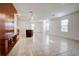 Open living room featuring tile flooring, natural light, and minimalist decor at 1567 Dawnview Way, Kissimmee, FL 34744