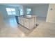 Modern kitchen island features granite countertops, cabinets, and stainless steel dishwasher at 1727 Buckeye Rd, Davenport, FL 33837