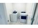 Well-lit laundry room with modern washer and dryer units at 1727 Buckeye Rd, Davenport, FL 33837