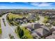 Stunning aerial view of a single-Gathering home in a well-maintained neighborhood with lush landscaping at 208 Almeria Way, Davenport, FL 33837