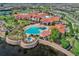 Aerial image of a community center featuring a pool, outdoor seating, and well-maintained landscaping at 208 Almeria Way, Davenport, FL 33837