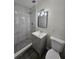 Modern bathroom featuring a shower with marble tile, a new vanity, and new fixtures at 2209 Sw 6Th St, Ocala, FL 34471