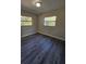 Bedroom featuring wood grain floors and a window at 2209 Sw 6Th St, Ocala, FL 34471