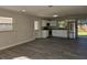 Well lit kitchen featuring stainless steel appliances, white cabinetry, and wood grain floors at 2209 Sw 6Th St, Ocala, FL 34471