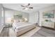 Stylish bedroom featuring modern decor, hardwood floors, and plenty of natural light, creating a peaceful retreat at 2488 Pine Chase Cir, St Cloud, FL 34769