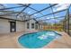 Screened-in pool area with bright blue water and concrete pool deck at 2488 Pine Chase Cir, St Cloud, FL 34769