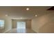 Spacious living room with sliding glass door at 2595 Buena View Road, Kissimmee, FL 34746