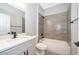 Modern bathroom with tiled shower and tub, gray vanity with white countertop, and matte black plumbing fixtures at 2609 Sw 154Th Lane, Ocala, FL 34473