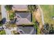 Detailed aerial view of rooftops and green spaces, showcasing neat landscaping at 280 Del Sol Ave, Davenport, FL 33837