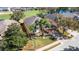 Aerial view of home showcasing golf course community, landscaping, and water view at 280 Del Sol Ave, Davenport, FL 33837