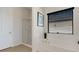 Bathroom featuring a soaking tub and separate glass-enclosed shower at 280 Del Sol Ave, Davenport, FL 33837