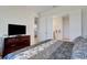 Bedroom featuring a dresser, television, and doorway to other rooms at 280 Del Sol Ave, Davenport, FL 33837