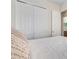 Bedroom featuring white bedding and sliding closet doors at 280 Del Sol Ave, Davenport, FL 33837