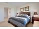 Comfortable bedroom featuring a patterned quilt, matching pillows, and decor at 280 Del Sol Ave, Davenport, FL 33837