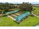 Overhead view of bocce ball courts with sunshades in a beautifully landscaped park at 280 Del Sol Ave, Davenport, FL 33837