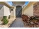 Inviting front entrance featuring a brick pathway and colorful landscaping at 280 Del Sol Ave, Davenport, FL 33837