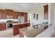 Kitchen with granite counters, stainless steel appliances, and dark wood cabinetry at 280 Del Sol Ave, Davenport, FL 33837