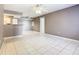 Bright and airy living room featuring tile flooring, neutral paint, and a ceiling fan at 3004 Parkway Blvd # 202, Kissimmee, FL 34747