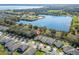 Aerial view of a residence with a lake in the background at 3204 Wauseon Dr, St Cloud, FL 34772