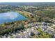 Aerial shot showing neighborhood near a lake, featuring a scenic and tranquil setting at 3204 Wauseon Dr, St Cloud, FL 34772