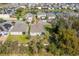 Aerial view of a home with landscaping and lush tree coverage at 3204 Wauseon Dr, St Cloud, FL 34772