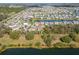 Aerial view of a residence, with a serene lake in the backdrop at 3204 Wauseon Dr, St Cloud, FL 34772