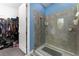 Updated bathroom featuring a tiled shower and glass door, as well as a closet at 3204 Wauseon Dr, St Cloud, FL 34772