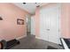 Carpeted bedroom with view to hallway, showing closet with double doors and neutral colors at 3204 Wauseon Dr, St Cloud, FL 34772