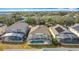 Aerial view shows the home's screened-in pool and backyard in a well-maintained neighborhood at 331 Henley Cir, Davenport, FL 33896