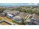 Aerial view showcases the home's screened-in pool and backyard, in a lush neighborhood at 331 Henley Cir, Davenport, FL 33896