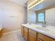 Bathroom featuring dual sinks, cabinet space, and vanity lighting at 331 Henley Cir, Davenport, FL 33896