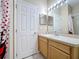 Cozy bathroom with a shower/tub, white cabinets and sink at 331 Henley Cir, Davenport, FL 33896