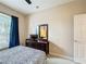 Neutral bedroom featuring a dresser and a window offering natural light with a ceiling fan at 331 Henley Cir, Davenport, FL 33896