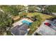 Aerial view showcases the community pool, landscaping, and parking at 331 Henley Cir, Davenport, FL 33896