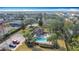 Aerial view of community pool and amenities, featuring a pool, lounge chairs and picnic area at 331 Henley Cir, Davenport, FL 33896